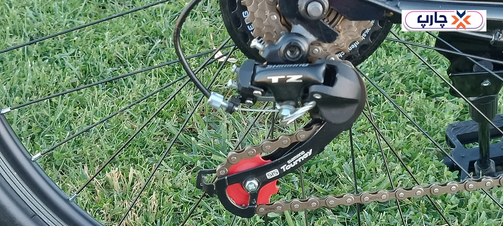 استفاده از دسته دنده 21 سرعته کلاج دار در دوچرخه سایز 26 دنده کلاجدار طرح المپیا رنگ مشکی قرمز