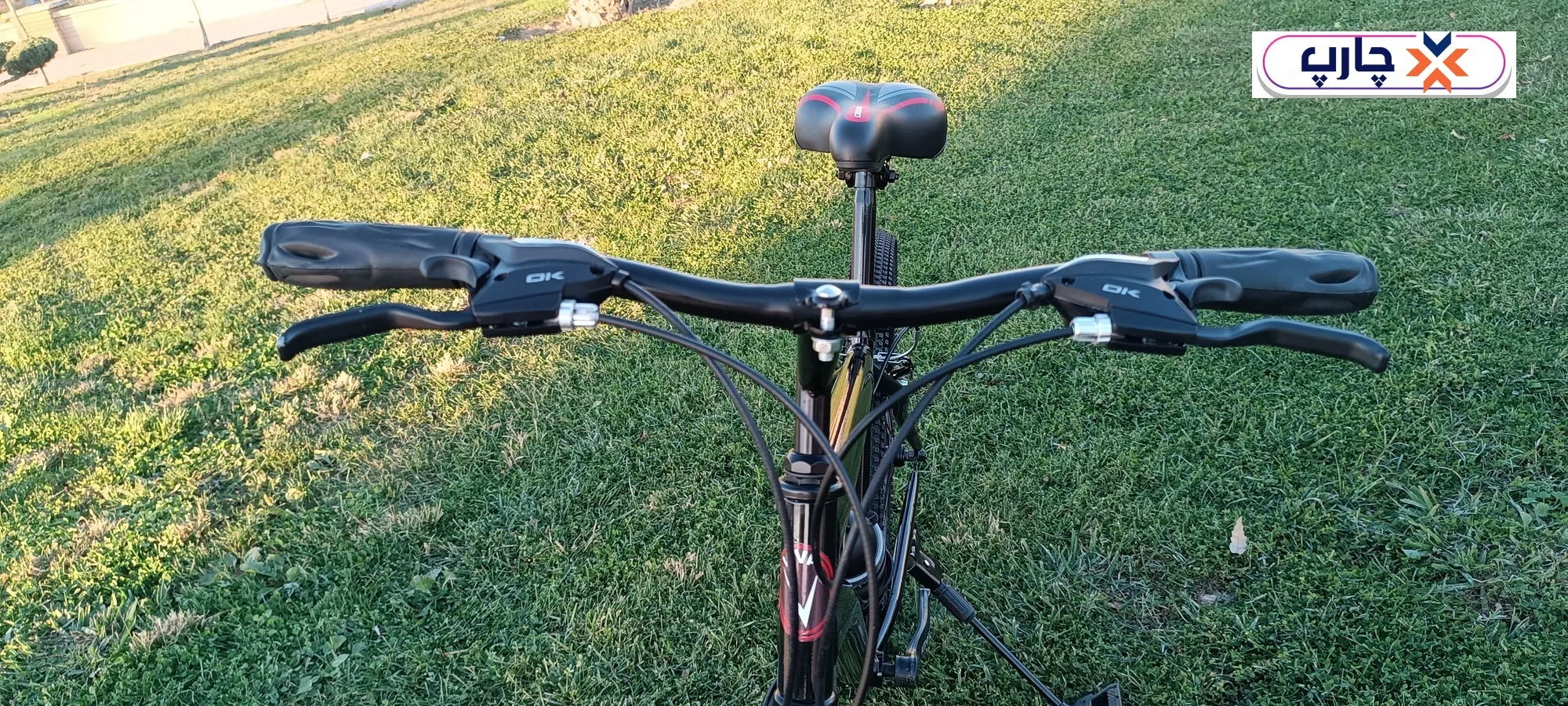 فرمان دانهیل استفاده از دسته دنده 21 سرعته کلاج دار در دوچرخه سایز 26 دنده کلاجدار طرح المپیا رنگ مشکی قرمز